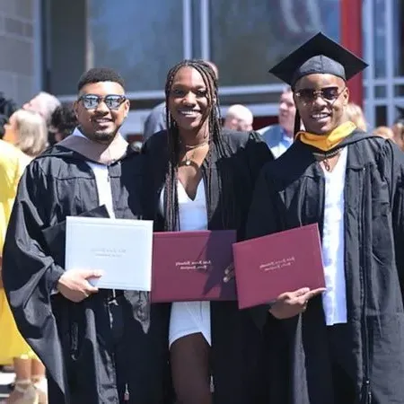 Three graduates holding SFU diplomas
